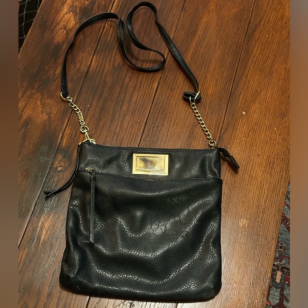Black faux leather Juicy Couture purse.